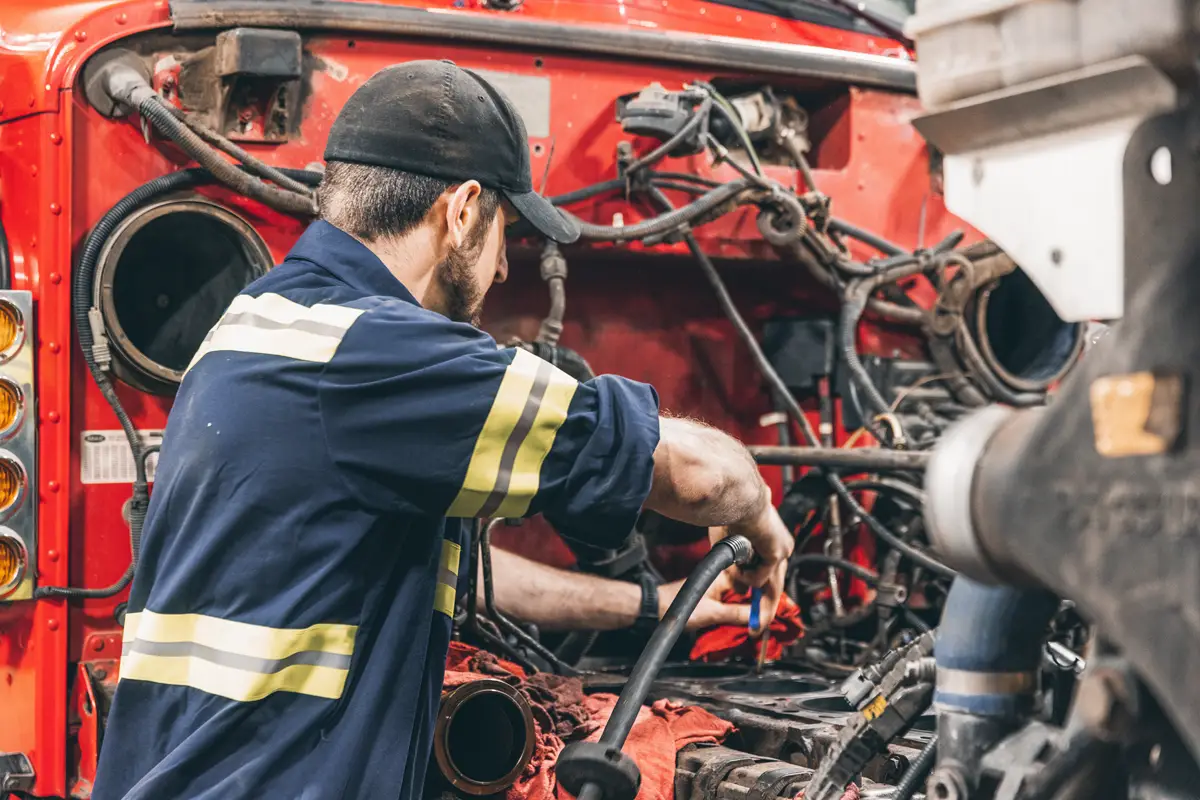 Diesel engine work in a heavy-duty repair bay